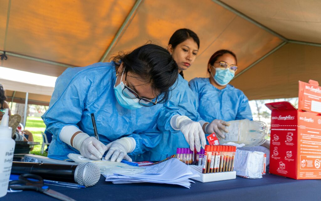 Healthcare professionals organizing a blood donation event in Piura, Peru.
